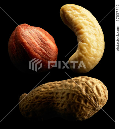 Group of nuts on black background. Close-up Group of nuts on black background. Close-up 37637742