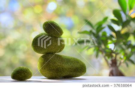 Balanced stones with moss 37638064