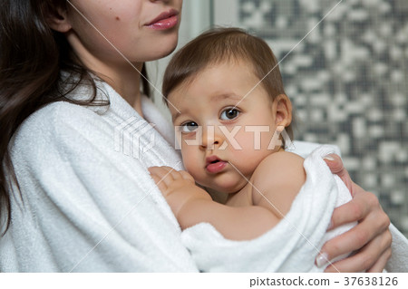 mother in a Bathrobe and with a child mother in a Bathrobe and with a child 37638126