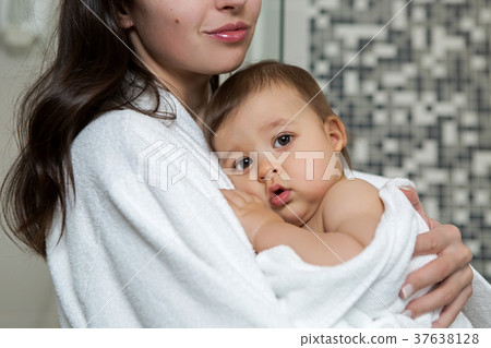 mother in a Bathrobe and with a child mother in a Bathrobe and with a child 37638128