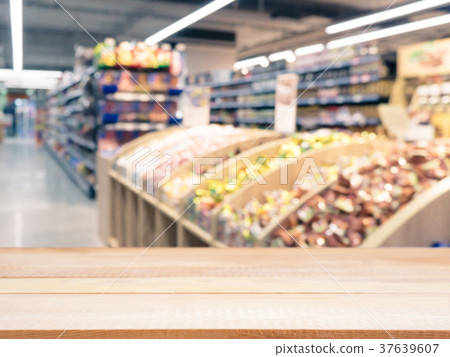 Empty table in front of blurred background Empty table in front of blurred background 37639607