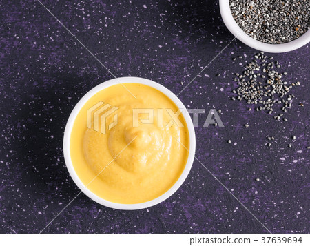 Vegan creamy cheddar cheese sauce with chia seeds Vegan creamy cheddar cheese sauce with chia seeds 37639694