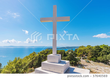 Cross on a mountain peak Cross on a mountain peak 37640569