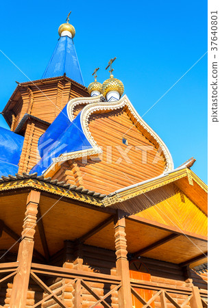 Traditional wooden orthodox church with domes  37640801