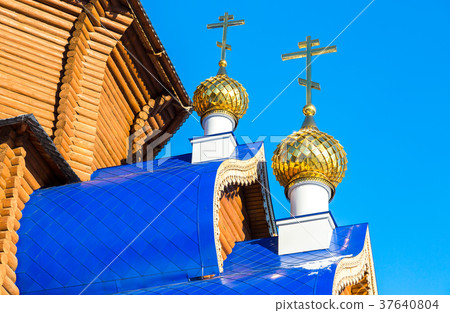 Golden domes with crosses on wooden Golden domes with crosses on wooden 37640804