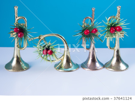 Three trumpets nad horn on the blue background Three trumpets nad horn on the blue background 37641124