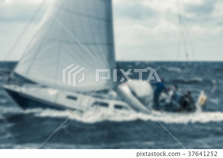 Blue sailboat - blurred image Blue sailboat - blurred image 37641252