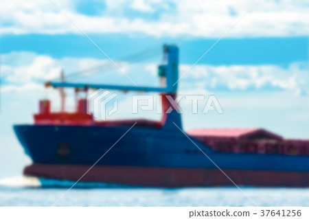 Blue cargo ship - blurred image 37641256