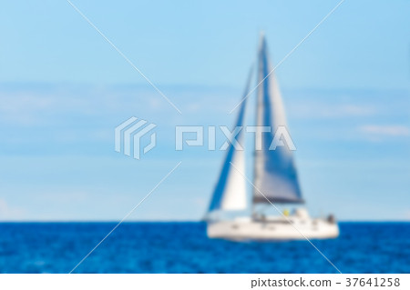 Blue sailboat - blurred image Blue sailboat - blurred image 37641258