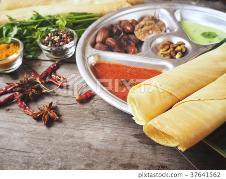 Masala dosa with sauce Indian food Masala dosa with sauce Indian food 37641562