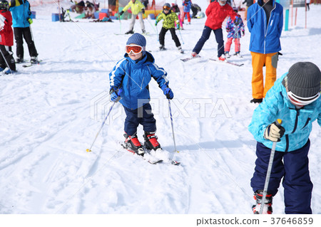 Children enjoying skiing 37646859