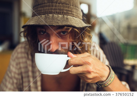 bearded guy drinking coffee bearded guy drinking coffee 37650152