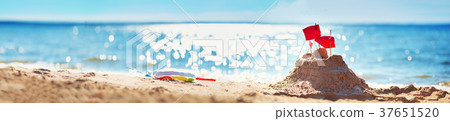 Sandcastle on the sea in summertime 37651520