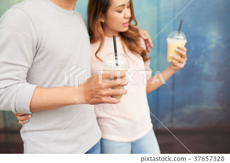 Dating couple with milkshakes Dating couple with milkshakes 37657328