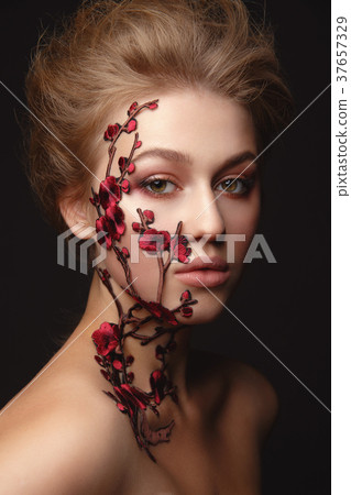 Young woman with flower makeup Young woman with flower makeup 37657329