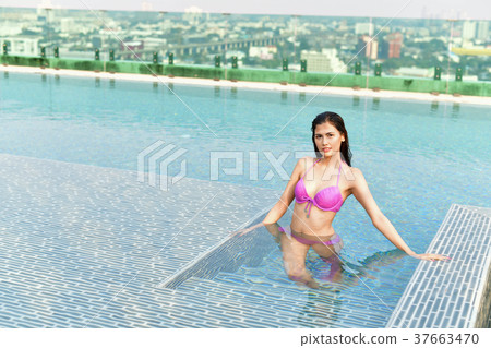 Swimsuit Concept. Beautiful girl wearing pink swimsuit. Beautifu 37663470