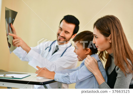 Health Concepts. Doctor and patient viewing x-ray film. The doct 37663525