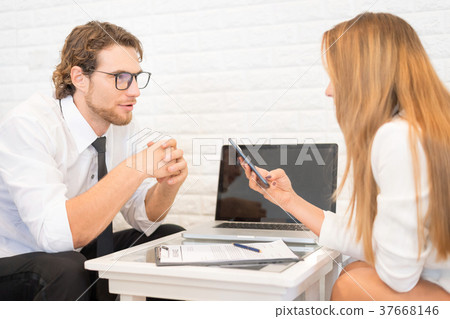 Businessman are using mobile and talk about job. Businessman are using mobile and talk about job. 37668146
