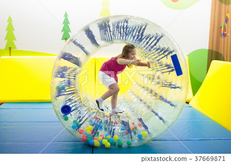 Child play in roller wheel. Kids on trampoline. Child play in roller wheel. Kids on trampoline. 37669871