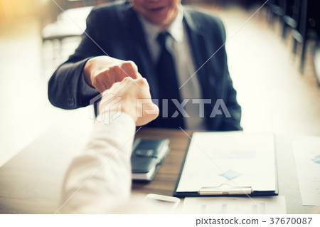 two business man use hand to fist bump two business man use hand to fist bump 37670087