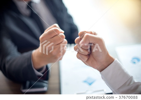 two business man use hand to fist bump two business man use hand to fist bump 37670088