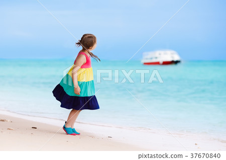 Kids on tropical beach. Children playing at sea. Kids on tropical beach. Children playing at sea. 37670840