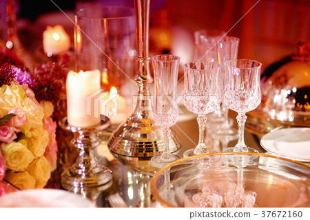 Beautiful table setting with crockery and flowers 37672160