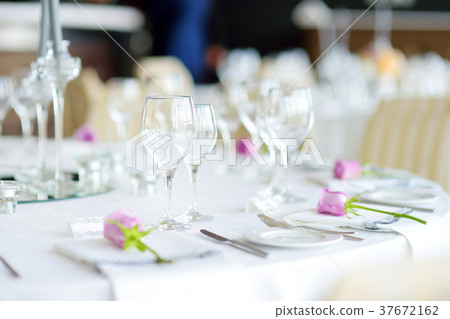 Beautiful table setting with crockery and flowers 37672162