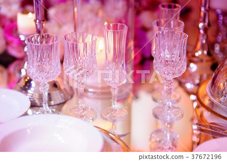 Beautiful table setting with crockery and flowers Beautiful table setting with crockery and flowers 37672196
