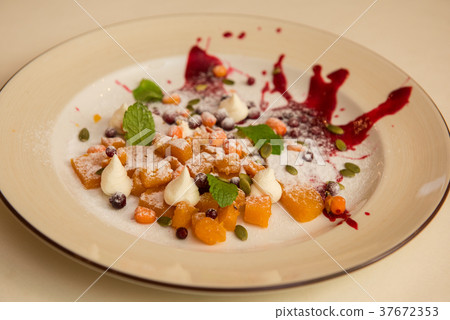 Tasty dessert from pumpkin and sea-buckthorn Tasty dessert from pumpkin and sea-buckthorn 37672353