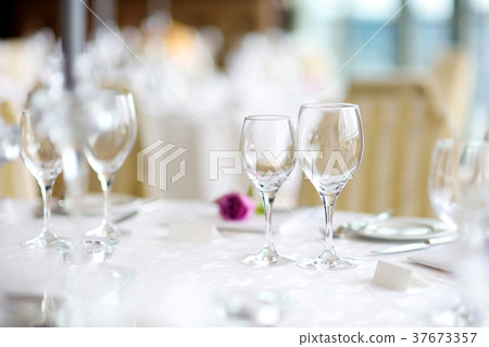 Beautiful table setting with crockery and flowers Beautiful table setting with crockery and flowers 37673357