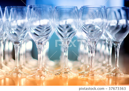 Lots of wine glasses during some festive event 37673363