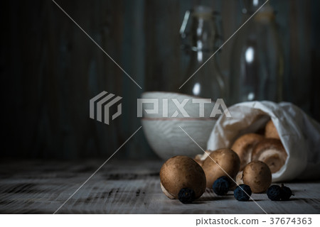Several edible mushrooms with brown hats Several edible mushrooms with brown hats 37674363