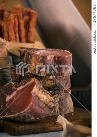Stack from few pieces of meat from wild boar Stack from few pieces of meat from wild boar 37674365