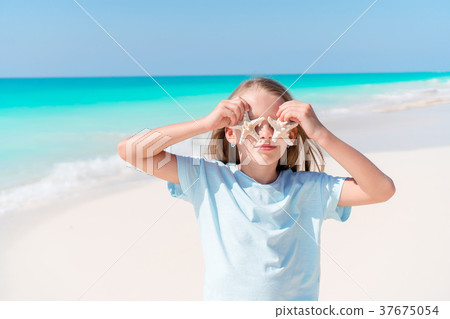 Adorable little girl with starfish on white empty 37675054