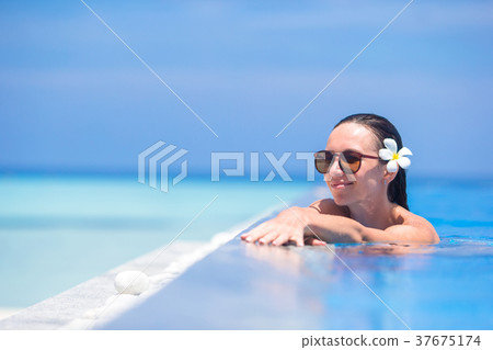 Young beautiful woman enjoying summer vacation in Young beautiful woman enjoying summer vacation in 37675174