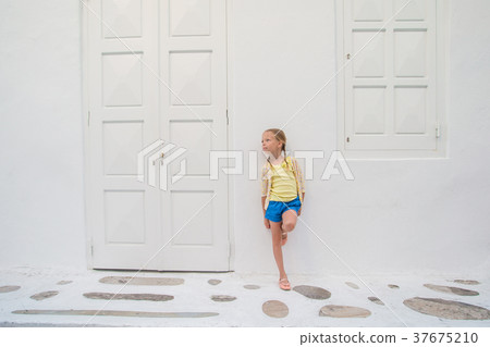 Little girl portrait outdoors in old greek village 37675210