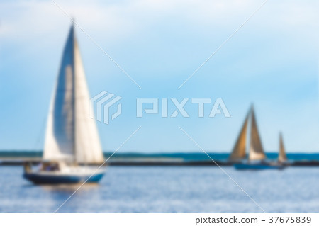 Blue sailboat - blurred image Blue sailboat - blurred image 37675839