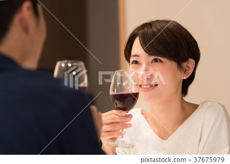 Middle couple drinking wine Middle couple drinking wine 37675979