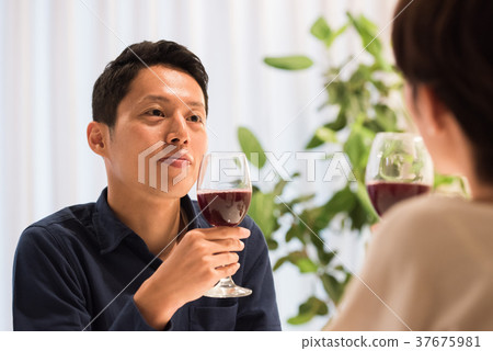 Middle couple drinking wine Middle couple drinking wine 37675981