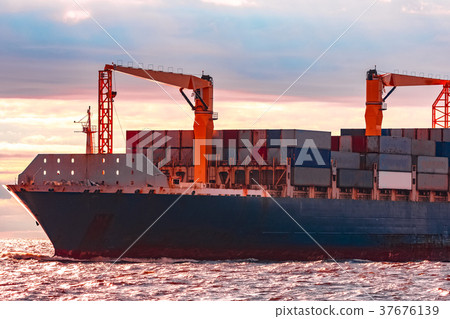 Blue container ship underway Blue container ship underway 37676139