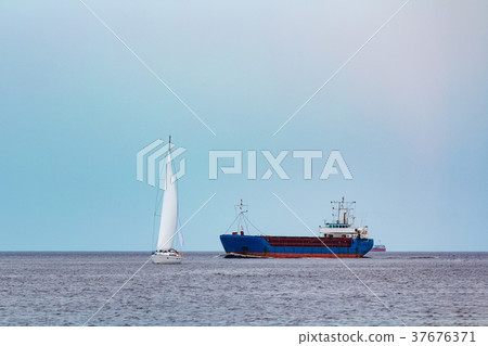 Blue cargo ship underway 37676371