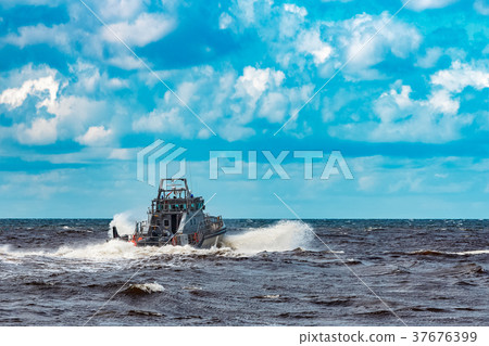 Grey military ship at sea 37676399