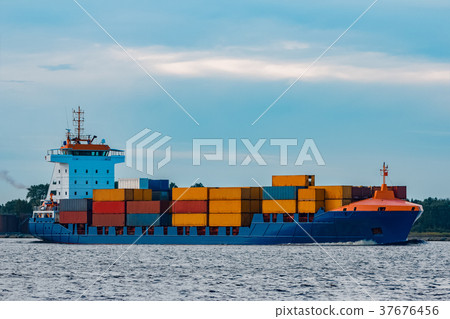 Blue container ship underway Blue container ship underway 37676456