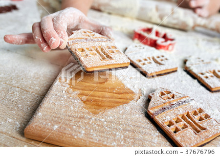 Child's hands decorate traditional Christmas Child's hands decorate traditional Christmas 37676796