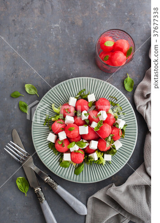 Fresh delicious salad with watermelon and feta Fresh delicious salad with watermelon and feta 37677338