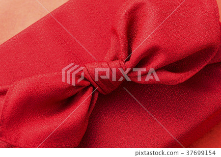 Up of the hand-made souvenir wrapped in a furoshiki 37699154