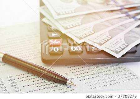 Dollars money, calculator on financial statement Dollars money, calculator on financial statement 37708279