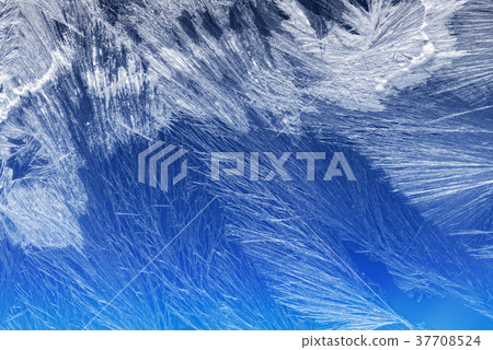 Frost pattern on a window glass Frost pattern on a window glass 37708524