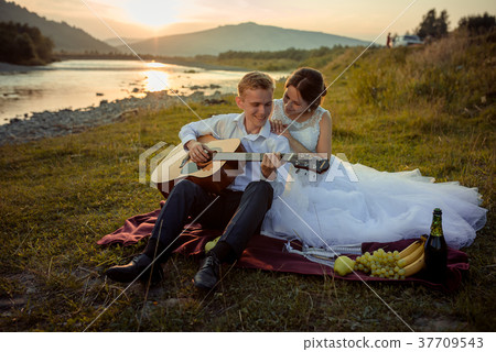 Wedding picnic composition on the river bank Wedding picnic composition on the river bank 37709543
